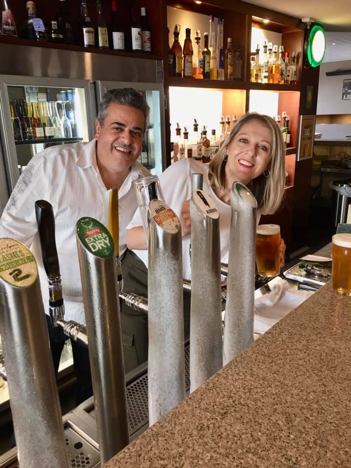 Happy couple enjoying their cold drinks